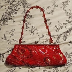 Red sequined clutch purse